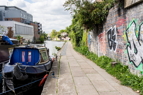 London, UK - April 2017. Narrowboats on the canalside towpath near Camden Town, , London, England, UK