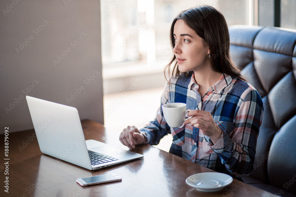 girl working with laptop in cafe girl working with laptop in cafe