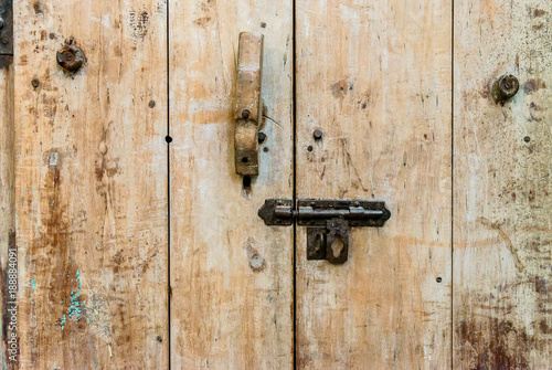 Old texture wooden door with old metal door handle