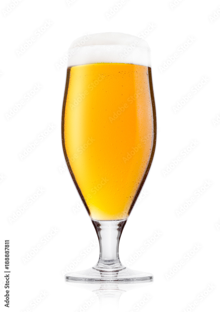 Cold glass of lager ale beer with foam and dew Cold glass of lager ale beer with foam and dew