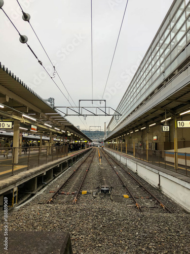 Empty train track in a cloudy day.