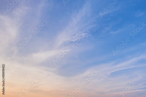Blue sky background with Dark gray clouds at sunset.