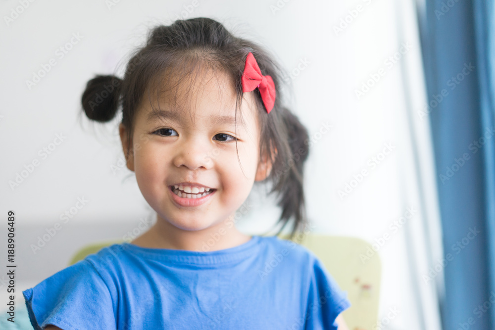 Happy funny Little asian girl eating yogurt and she holding spoon in her hands. Happy funny Little asian girl eating yogurt and she holding spoon in her hands.