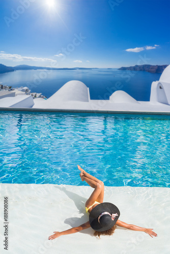 Woman enjoying relaxation in pool and looking at the view © Netfalls