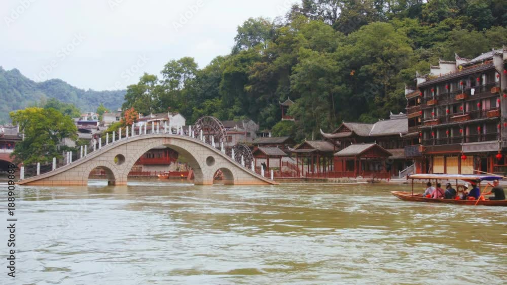 Traditional Chinese boat sailing along the Tuojiang River Traditional Chinese boat sailing along the Tuojiang River