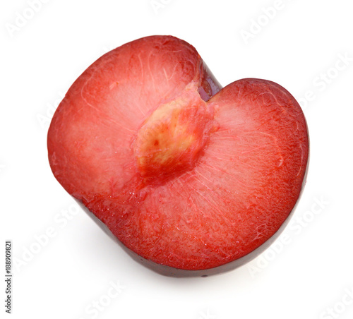 Half of red plum fruit isolated on white background