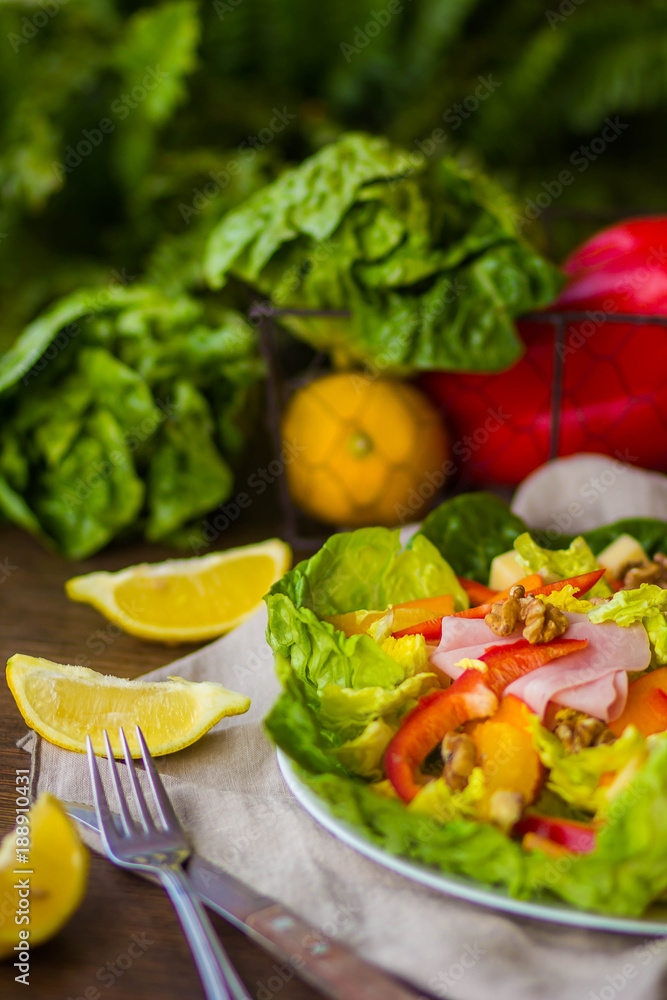 bowl of fresh salad with vegetables and greens on wooden table bowl of fresh salad with vegetables and greens on wooden table
