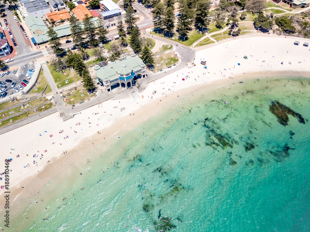 Aerial photograph over a busy Cottesloe Beach, Perth, Western Australia, on a clear summer afternoon. 