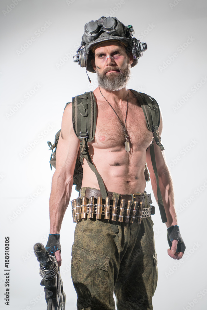 Modern soldier in an unusual helmet and with an unusual automatic weapon Modern soldier in an unusual helmet and with an unusual automatic weapon