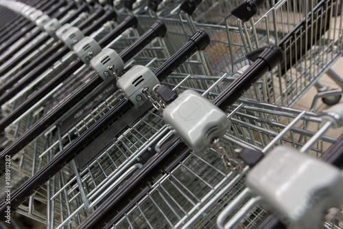 Many empty shopping carts in a row © BY-_-BY