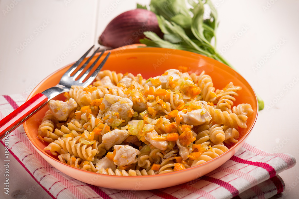 pasta with chicken and carrots, selective focus pasta with chicken and carrots, selective focus