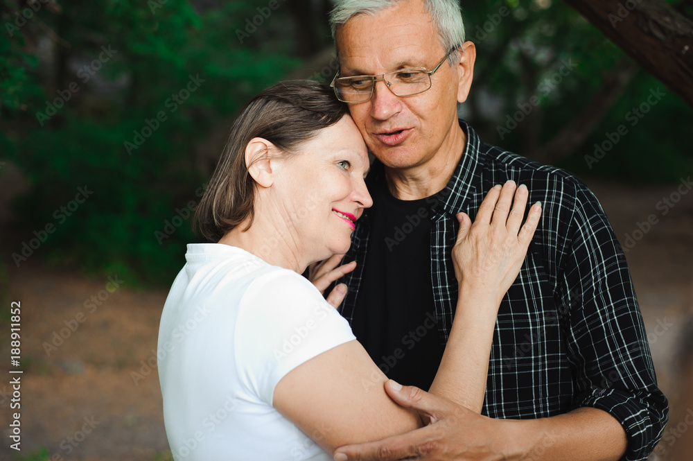 Senior couple strolling in the park Senior couple strolling in the park