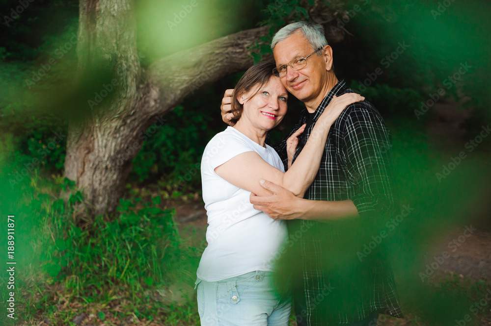 Senior couple strolling in the park Senior couple strolling in the park