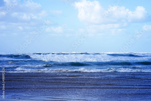 Beautiful wave on the beach. Early morning and strong wind. Cloudy morning.