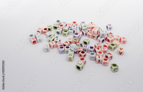a lot of colorful cubes with letters on a white background