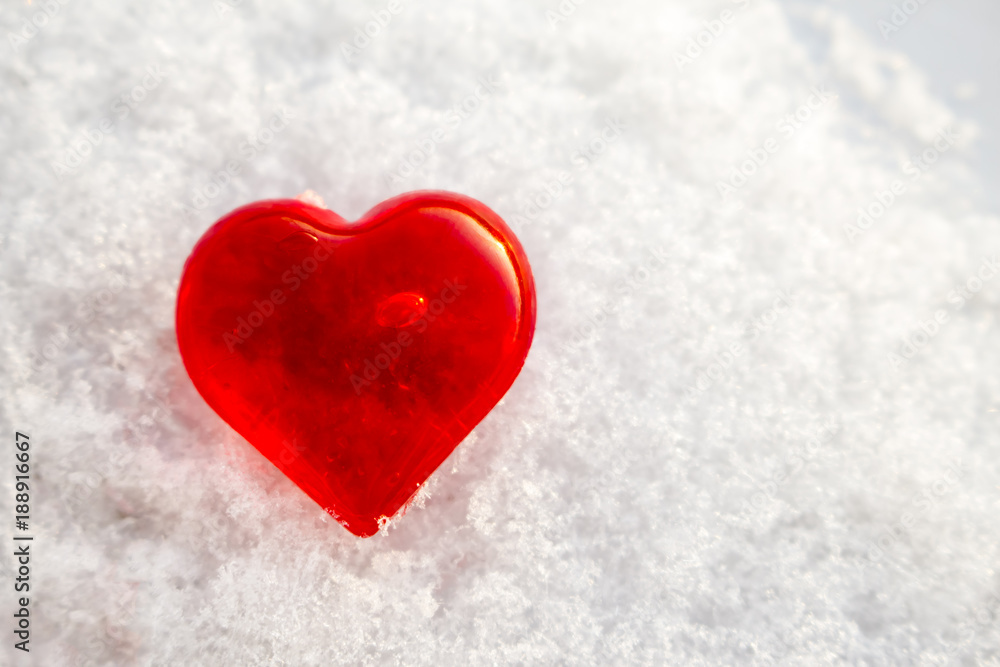 red heart on the snow