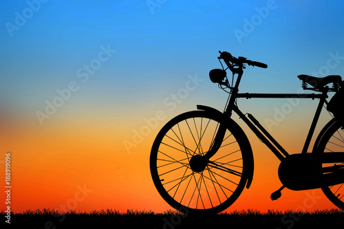 Fototapeta Naklejka Na Ścianę i Meble -  silhouette vintage bike on sunrise.
