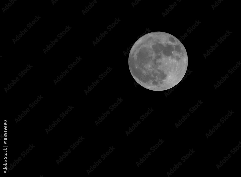 big full moon in the middle of the black sky in winter big full moon in the middle of the black sky in winter