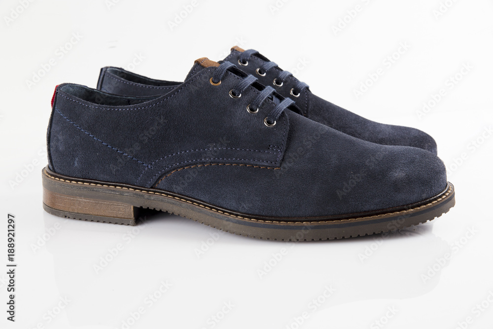 Male blue leather shoe on white background, isolated product, comfortable footwear. Male blue leather shoe on white background, isolated product, comfortable footwear.