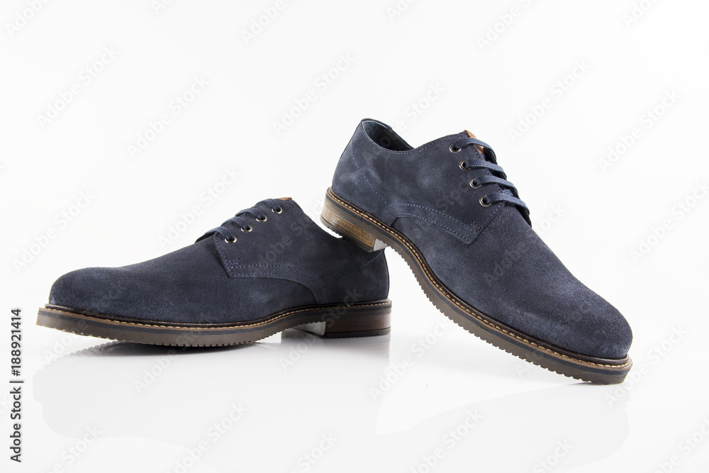 Male blue leather shoe on white background, isolated product, comfortable footwear. Male blue leather shoe on white background, isolated product, comfortable footwear.