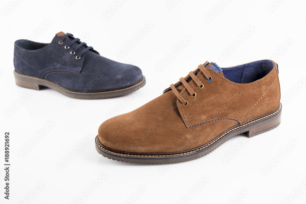 Male brown and blue leather shoe on white background, isolated product, comfortable footwear. Male brown and blue leather shoe on white background, isolated product, comfortable footwear.