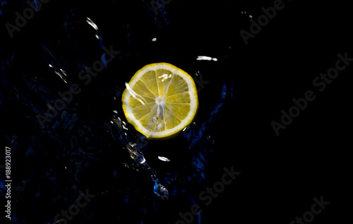 fruits in water on black backround
