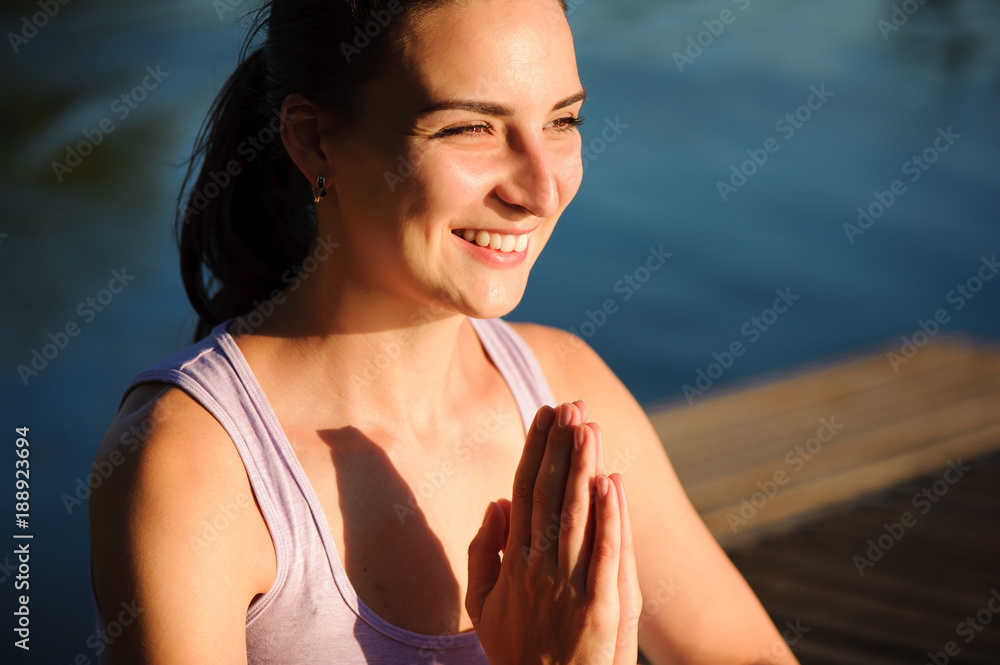 Healthy woman lifestyle balanced practicing meditate and energy yoga on the bridge in morning the nature. Healthy Concept.