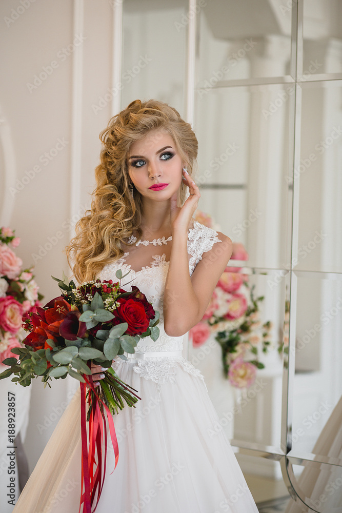 Bride in wedding dress with bouquet in hands Bride in wedding dress with bouquet in hands