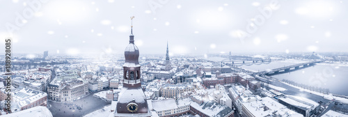 Amazing aerial view of the Riga old town (vecriga) in January during barracades memorial winter day. Snowing in Latvia. photo