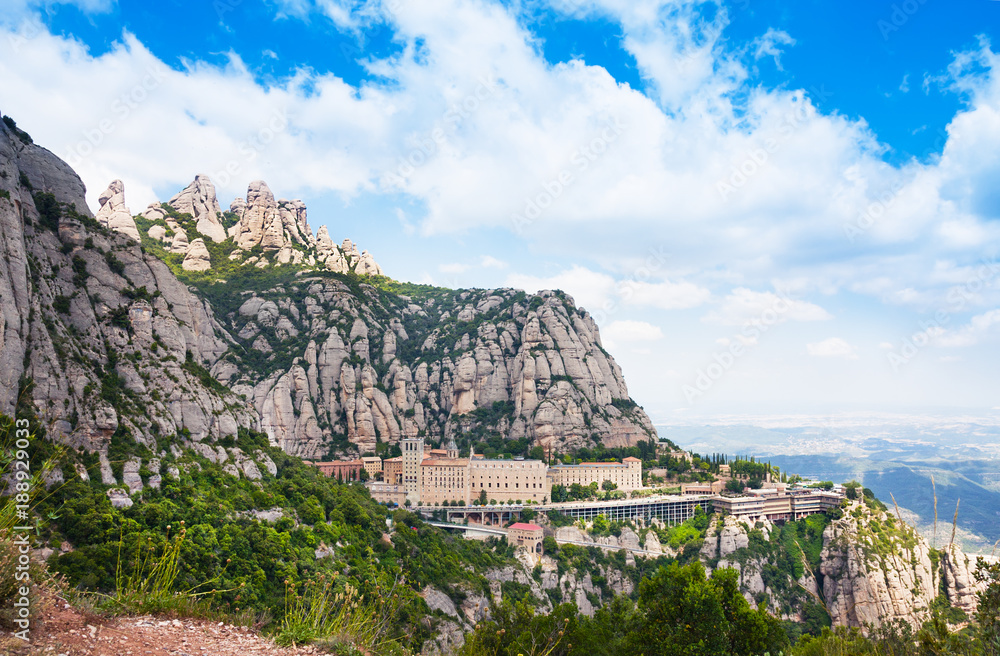 Aerial view of the Montserrat monastery. Santa Maria de Montserrat is a Benedictine abbey located on the mountain of Montserrat, in Monistrol de Montserrat, in Catalonia, Spain