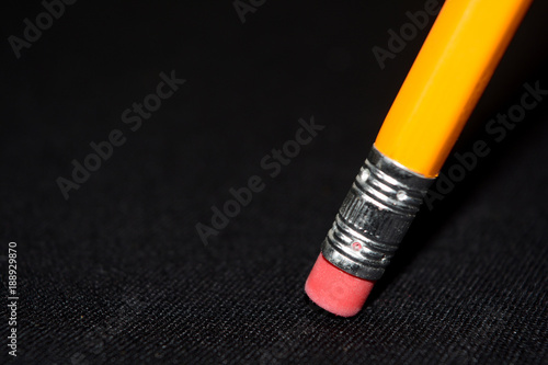 Two yellow Pencils on dark black blurred background. stationery. Office tool. Business concept. Back to school. Draw. Space for text. photo