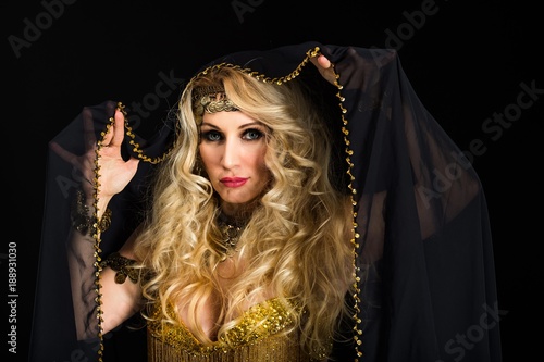 Woman fortune teller portrait on black photo