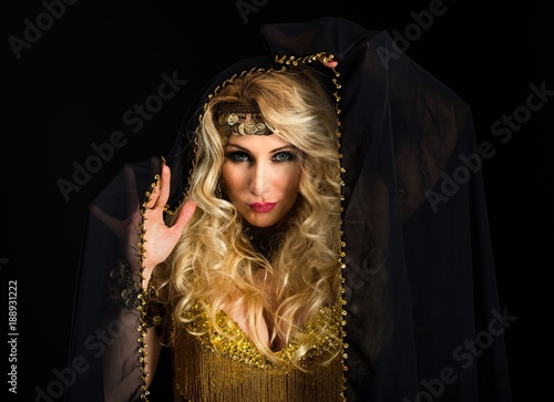 Woman fortune teller portrait on black photo