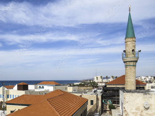 Acre or Akko, Israel - view of the typical domes, minarets and roofs of the old city of Acre. photo