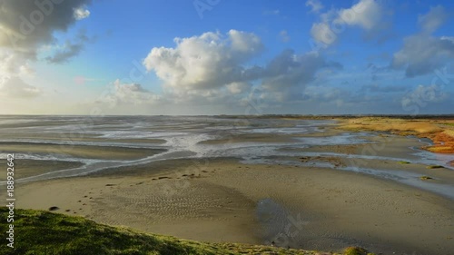 low tide at intertidal coastal mudflat zone TIMELAPSE photo