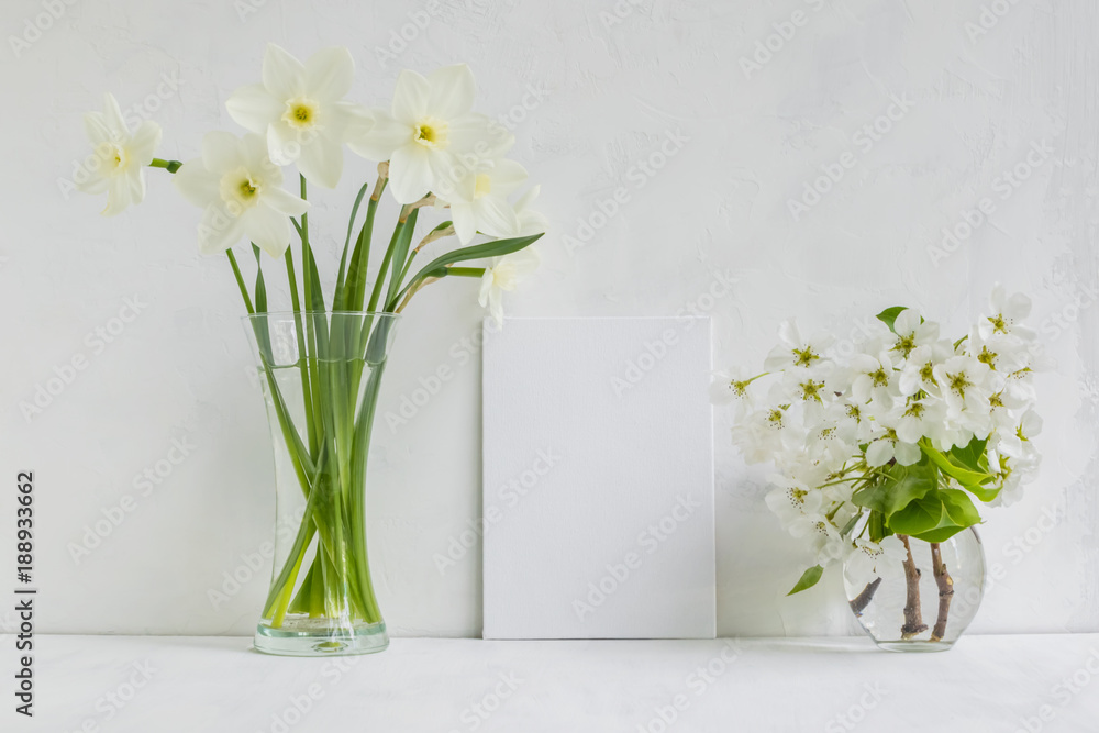 Mockup with a white frame and white daffodils in a vase