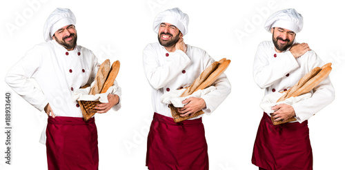 Young baker holding some bread with neck pain