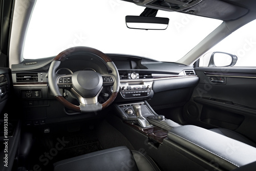 Luxury car inside. Interior of prestige modern car. Comfortable leather seats. Black perforated leather cockpit with isolation on white. Clipping path