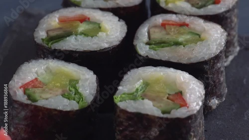 Wallpaper Mural Japanese restaurant, sushi roll on black slate plate. Set for one person with chopsticks, ginger, soy Torontodigital.ca