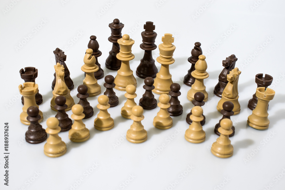 Chess pieces composition in a white background Chess pieces composition in a white background