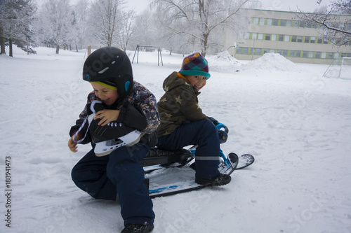 Children playing outdoors on the snow