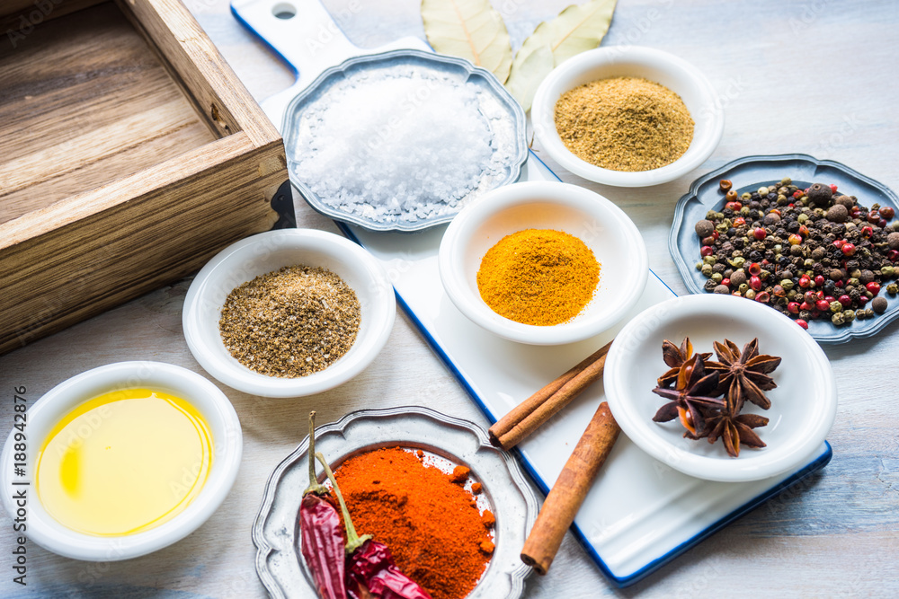 Different spices on white wooden table Different spices on white wooden table