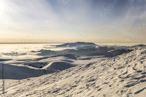 peaks of mountains above the clouds © zane38
