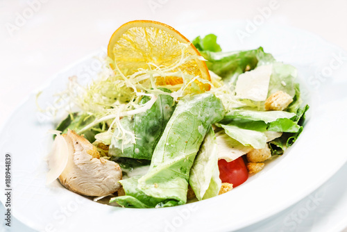 caesar salad on the white plate
