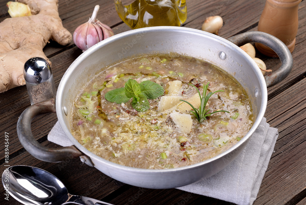Saucepan with vegetable and cereal soup Saucepan with vegetable and cereal soup