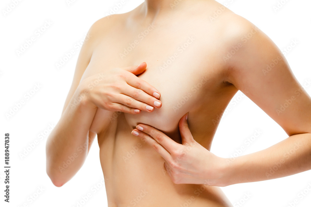 Fototapeta premium Woman examining breast isolated on white background