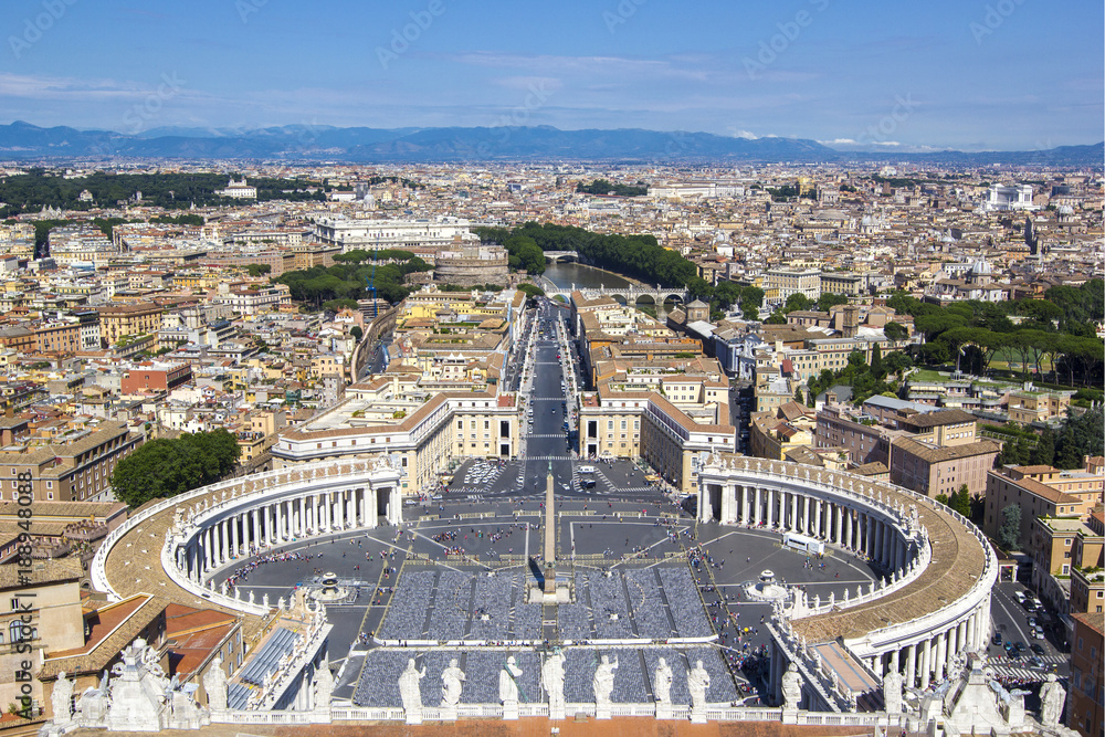 Panoramic view from the air to Saint Peter's Square, Vatican City and Rome, the Tibet River and mountains on the horizon on a summer sunny day, Italy