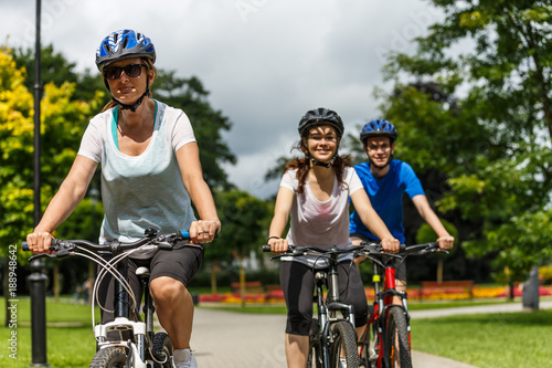 Healthy lifestyle - people riding bicycles in city park © Jacek Chabraszewski