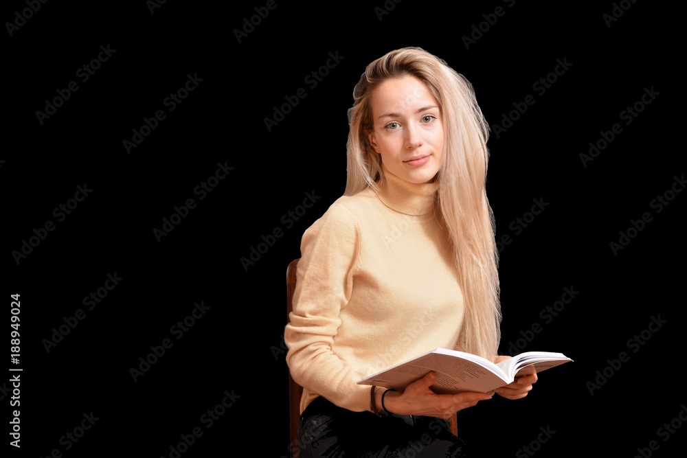 Portrait of blond girl with long beautiful hair on black background Portrait of blond girl with long beautiful hair on black background