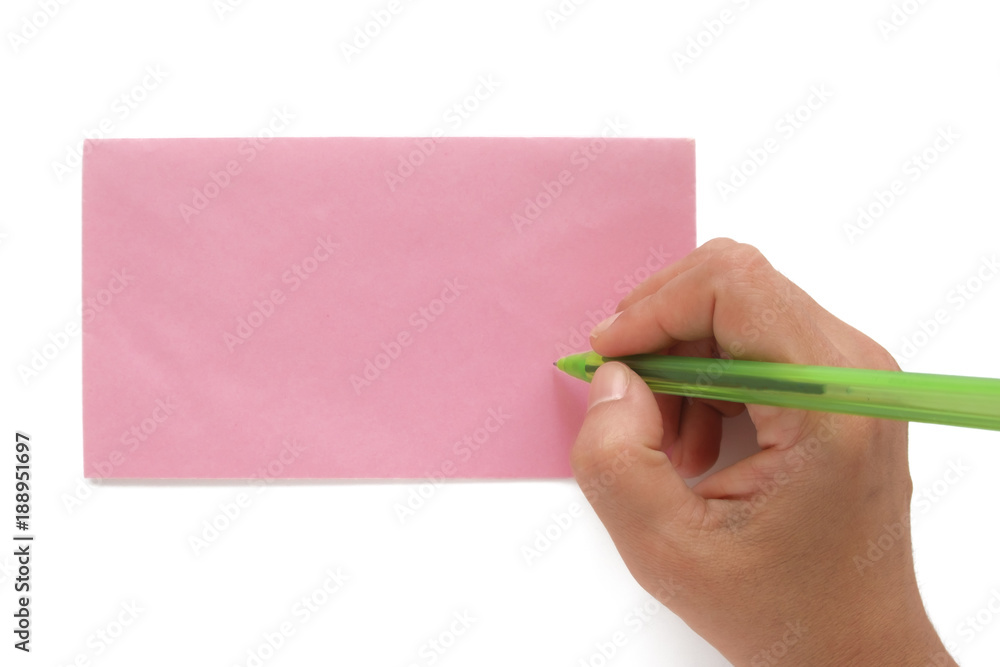 Hand being addressed on a pink envelope Hand being addressed on a pink envelope